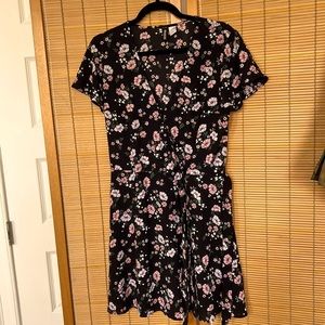 Sweet floral wrap summer dress with snap buttons and tie for closure.